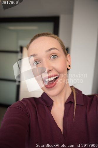 Image of business woman making funny face