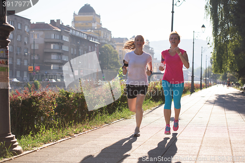 Image of female friends jogging