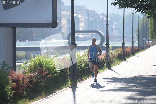 Image of handsome senior man  jogging