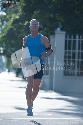 Image of handsome senior man  jogging