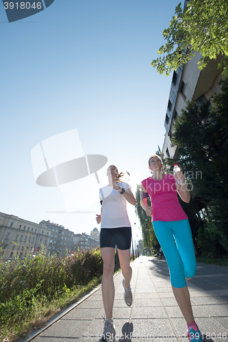 Image of female friends jogging