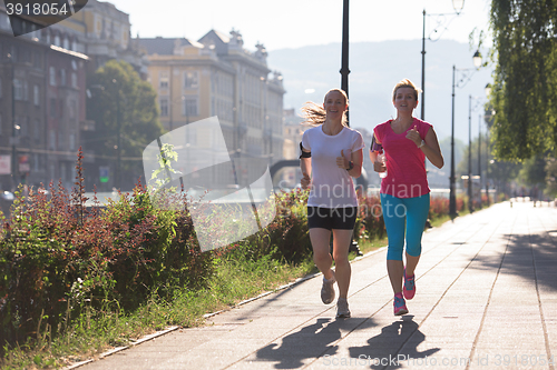 Image of female friends jogging