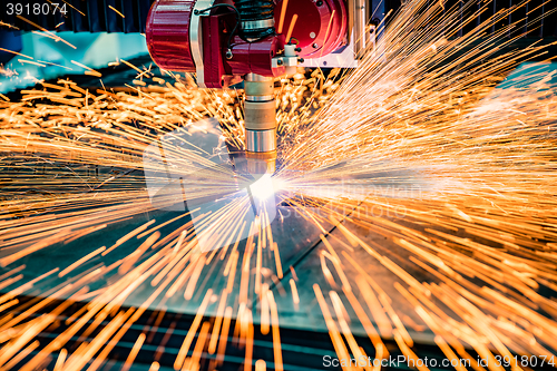 Image of CNC Laser cutting of metal, modern industrial technology.