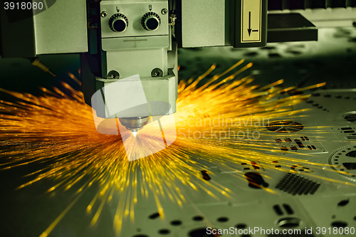 Image of CNC Laser cutting of metal, modern industrial technology.