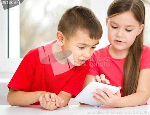 Image of Children are using tablet