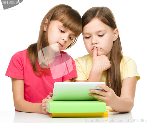 Image of Children are using tablet