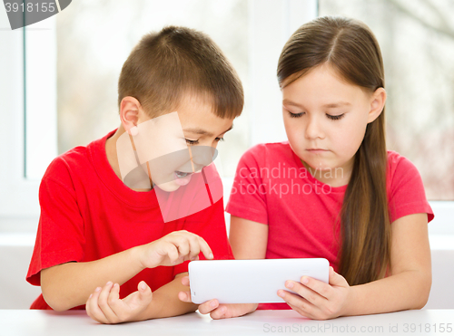 Image of Children are using tablet