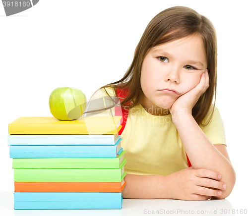 Image of Little girl with her books