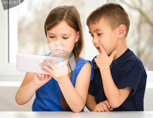 Image of Children are using tablet