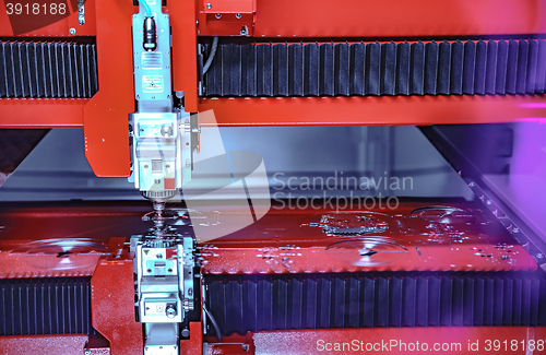 Image of CNC Laser cutting of metal, modern industrial technology.