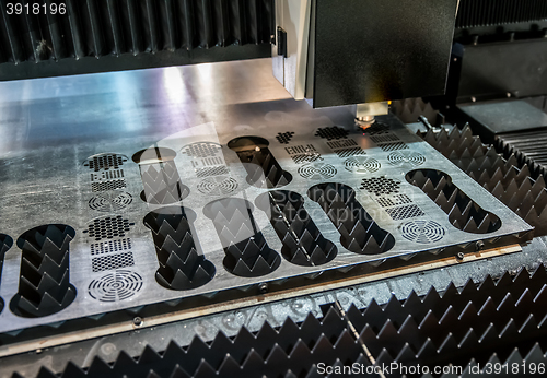 Image of CNC Laser cutting of metal, modern industrial technology.