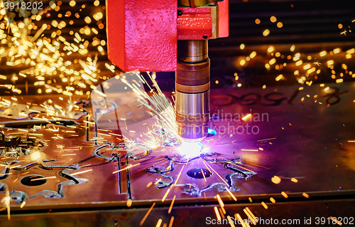 Image of CNC Laser cutting of metal, modern industrial technology.