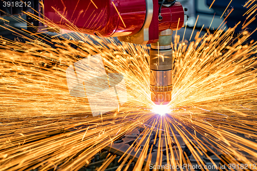 Image of CNC Laser cutting of metal, modern industrial technology.