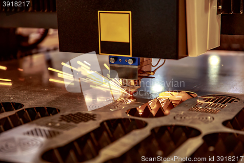 Image of CNC Laser cutting of metal, modern industrial technology.