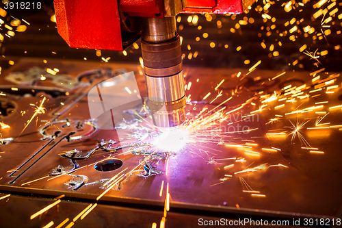 Image of CNC Laser cutting of metal, modern industrial technology.