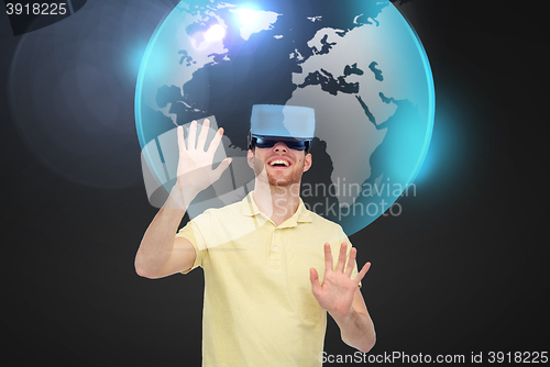 Image of happy man in virtual reality headset or 3d glasses