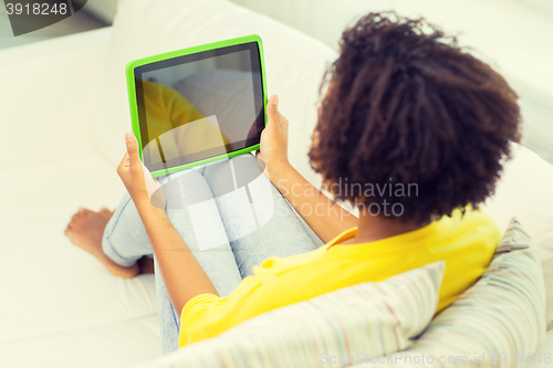 Image of happy african american woman with tablet pc