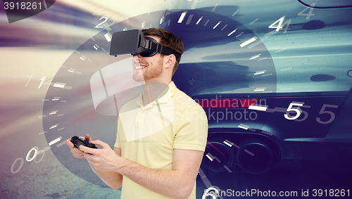 Image of man in virtual reality headset and car racing game