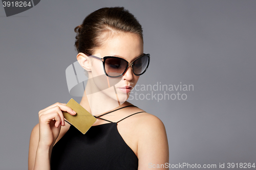 Image of beautiful young woman in elegant black sunglasses