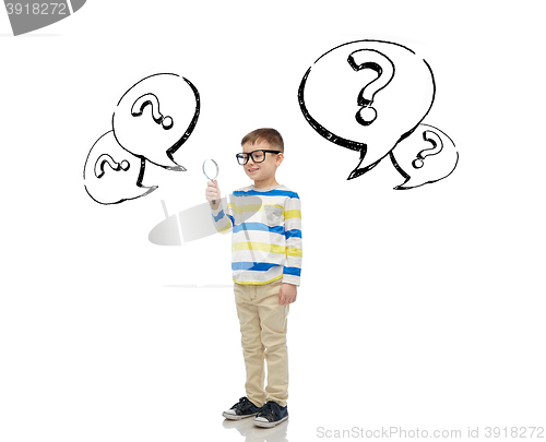 Image of little boy in eyeglasses with magnifying glass