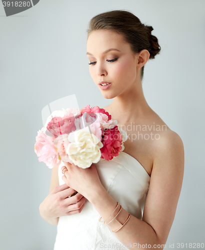 Image of beautiful asian woman with flower and jewelry