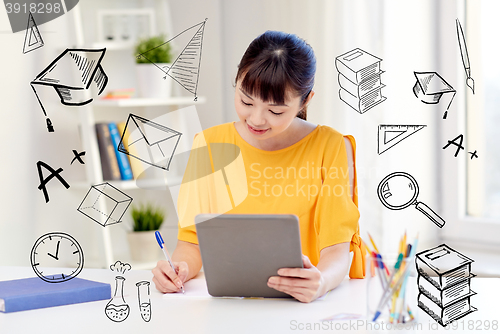 Image of asian woman student with tablet pc at home