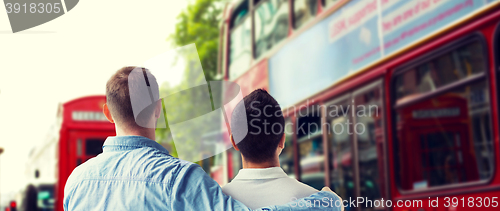 Image of close up of gay couple hugging over london city