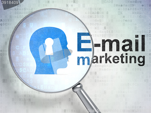 Image of Marketing concept: Head With Keyhole and E-mail Marketing with optical glass