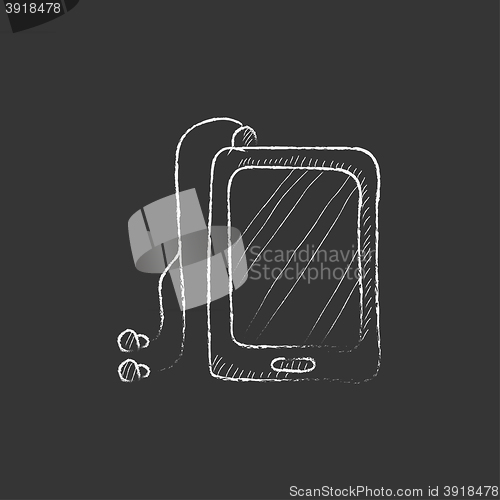 Image of Tablet with headphones. Drawn in chalk icon.