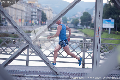 Image of handsome senior man  jogging