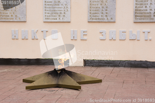 Image of Vityazevo, Russia - March 14, 2016: The eternal flame and the words \"No one is forgotten,\" close-up, on a monument in honor of the dead villagers Vityazevo in the Great Patriotic War 1941-1945