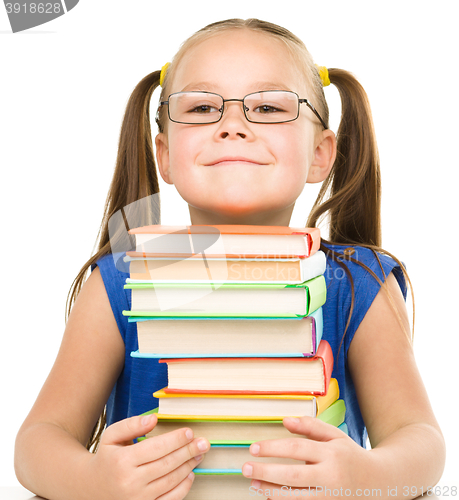 Image of Little girl with books