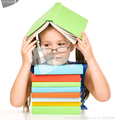 Image of Little girl with books