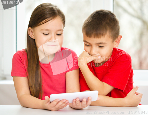 Image of Children are using tablet