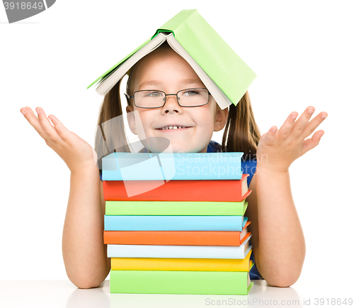 Image of Little girl with books