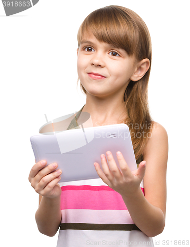 Image of Young girl is using tablet