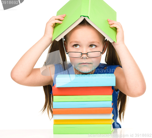 Image of Little girl with books