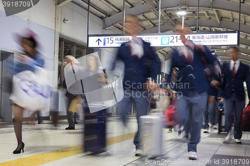 Image of Business people traveling by Tokyo metro.