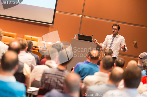 Image of Speaker at Business Conference and Presentation.