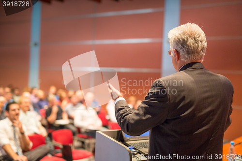 Image of Speaker at Business Conference and Presentation.