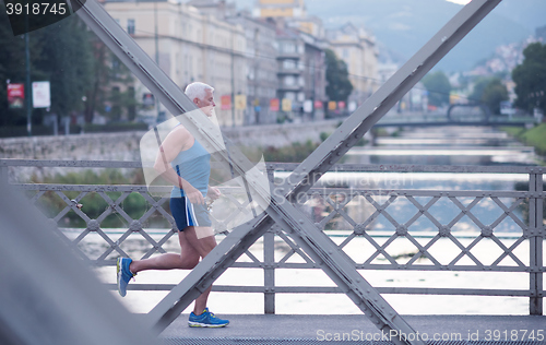 Image of handsome senior man  jogging