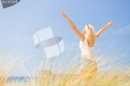 Image of Free Happy Woman Enjoying Sun on Vacations.