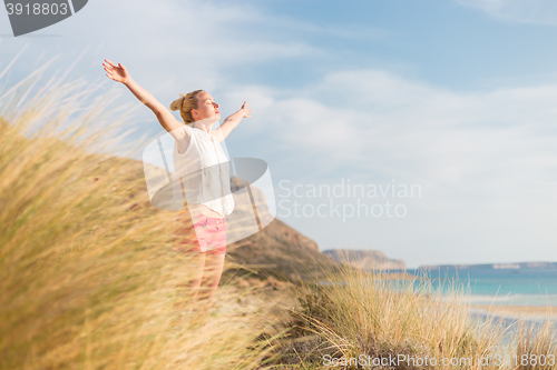 Image of Free Happy Woman Enjoying Sun on Vacations.