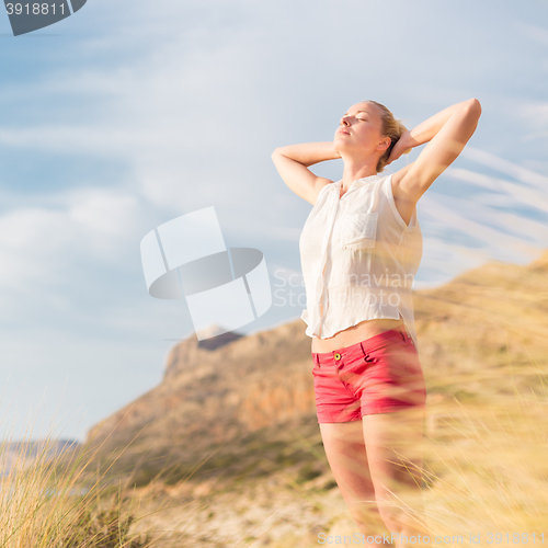 Image of Free Happy Woman Enjoying Sun on Vacations.