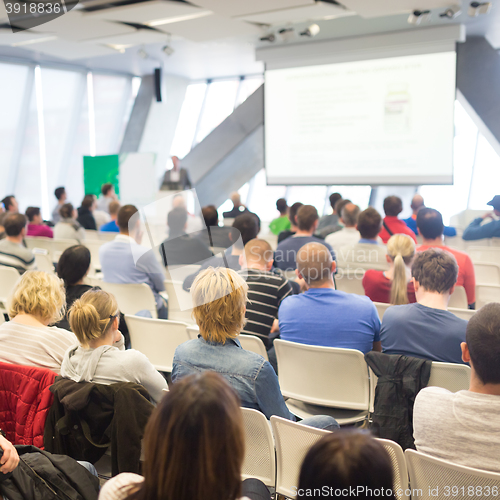 Image of Male speeker having talk at public event.