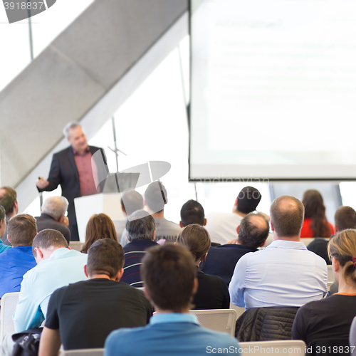 Image of Male speeker having talk at public event.