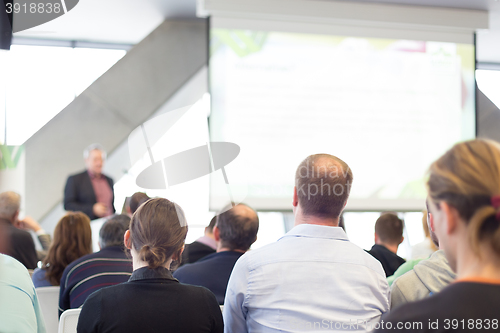 Image of Male speeker having talk at public event.