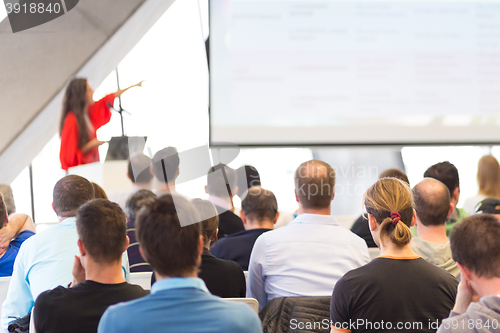 Image of Female speeker having talk at public event.