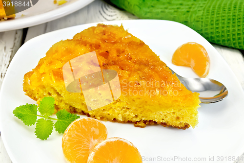 Image of Pie mandarin with mint and spoon on board