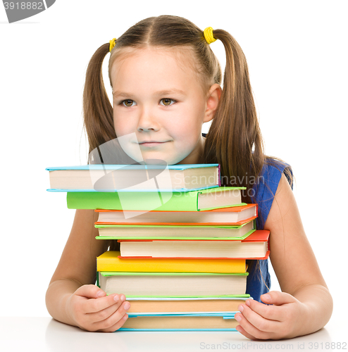 Image of Little girl with books